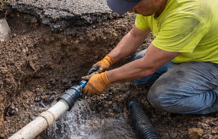 fixing pipe leak under asphalt driveway
