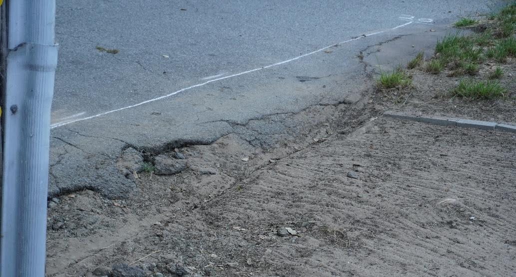 Cracked, crumbling edge of the upper section after the dirt was filled in, still in need of repair